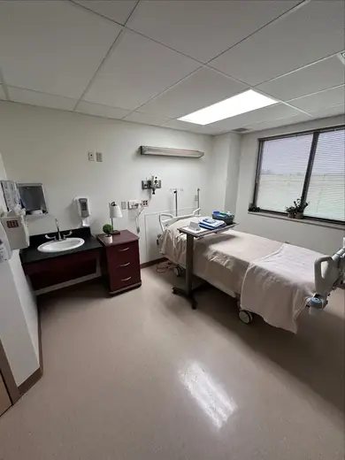 Clean patient room with medical equipment at Genesis Medical Detox, a detox center in Dallas.