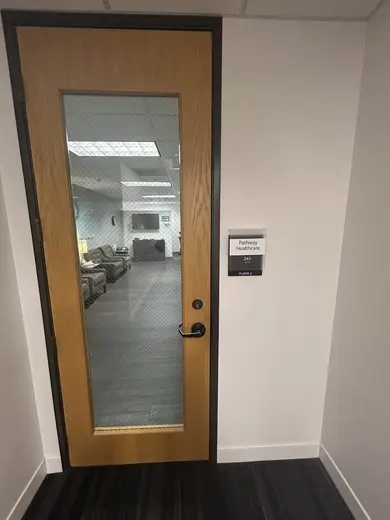 Glass-paneled door leading to Pathway Healthcare detox center in Dallas.