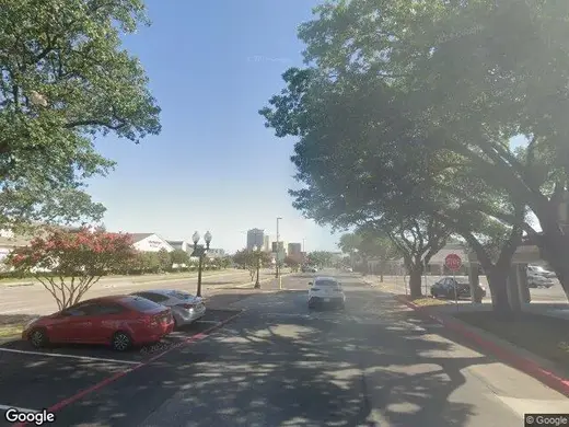 Tree-lined street view near Relive Health Dallas, a detox center in Dallas.