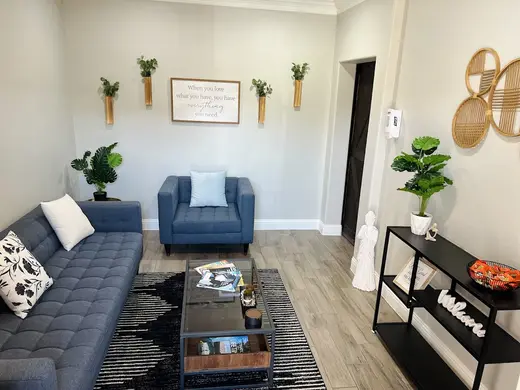 Cozy living room with modern decor at Redeem Recovery Centers: Lewisville, detox center in Dallas.