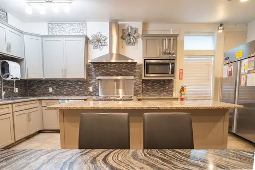 Modern kitchen with granite countertops at New Choices Treatment Centers, a detox center in Dallas.