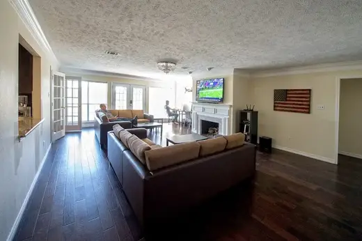 Spacious living room with cozy couches at Chapter House Sober Living, a sober living home in Dallas.