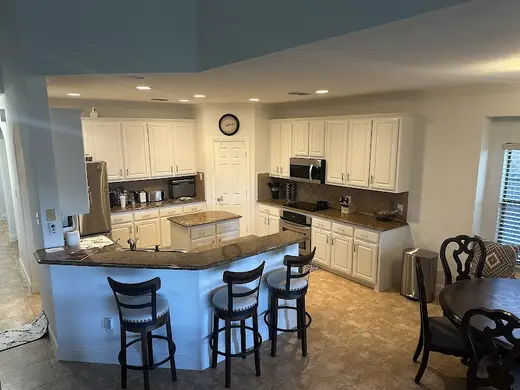 Modern kitchen with island at Sober Living Houses for Men & Women, a sober living home in Dallas.