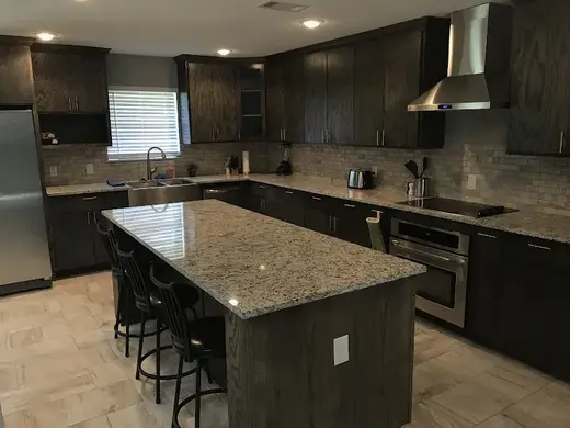 Modern kitchen with granite countertops at ASIC Recovery Sober Living, a sober living home in Dallas.