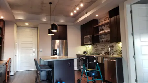 Modern kitchen with island at Twice Blessed Post-Transplant Housing, a sober living home in Dallas.