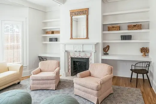 Cozy sitting area with armchairs at Magdalen House Women's Location, a sober living home in Dallas.
