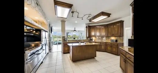 Modern kitchen with island at Women's Elevated Sober Living, a sober living home in Dallas.