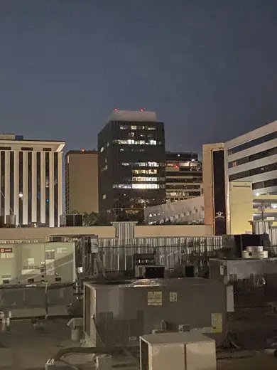 Night view of modern buildings near Preston Group treatment center in Dallas.