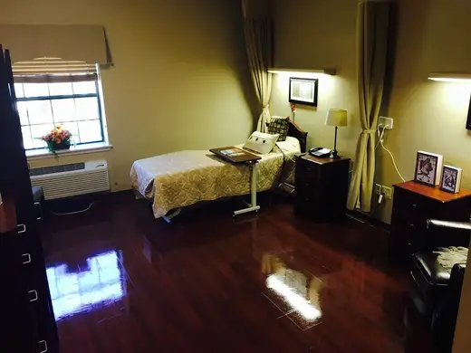 Cozy bedroom with single bed at Forest Park Nursing & Rehabilitation, a treatment center in Dallas.